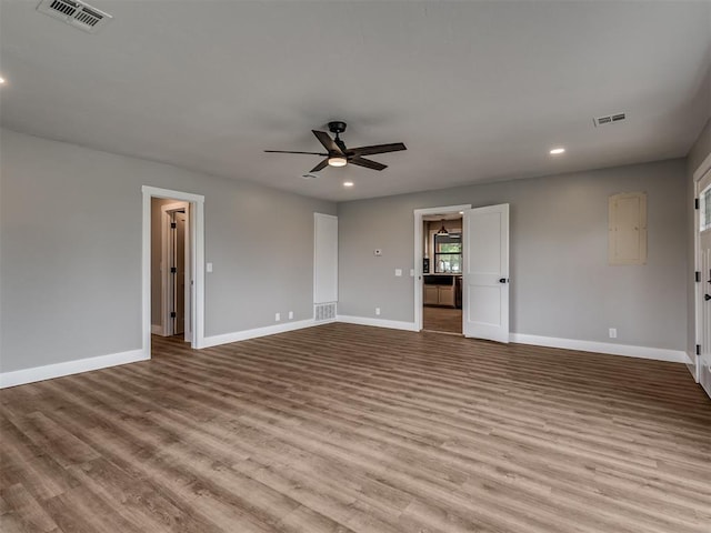 16101 S Rock Creek Rd, Shawnee, OK 74801 - spare room featuring wood finished floors, a ceiling fan, baseboards, and recessed lighting