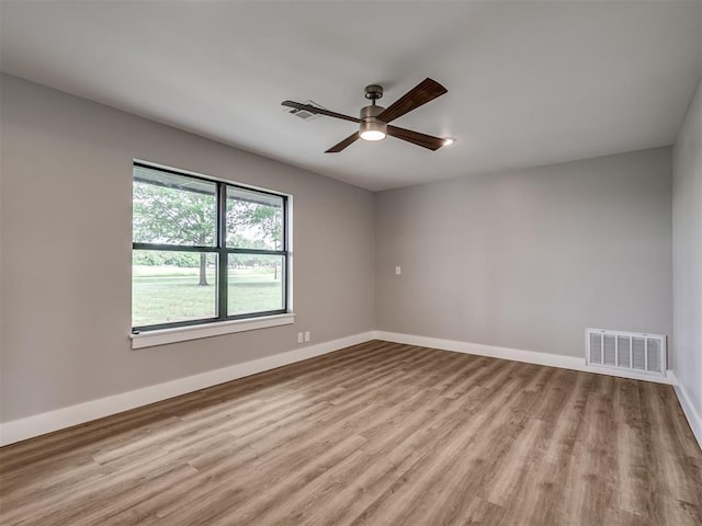 16101 S Rock Creek Rd, Shawnee, OK 74801 - unfurnished room featuring ceiling fan, wood finished floors, and baseboards