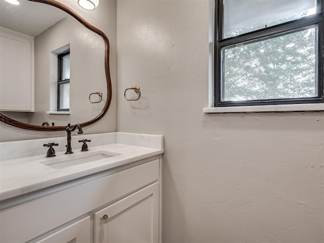 16101 S Rock Creek Rd, Shawnee, OK 74801 - bathroom featuring vanity and a textured wall