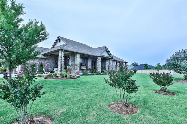 3434 Crampton Gap Way, Norman, OK 73069 - view of front of house with a shingled roof and stone siding