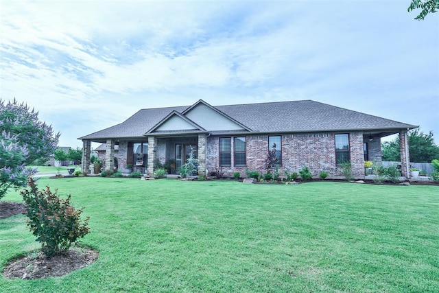 3434 Crampton Gap Way, Norman, OK 73069 - view of front facade featuring a front lawn, a shingled roof, and brick siding