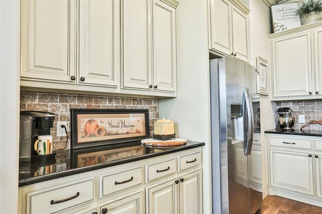 3434 Crampton Gap Way, Norman, OK 73069 - kitchen featuring stainless steel refrigerator with ice dispenser, backsplash, cream cabinets, and wood finished floors