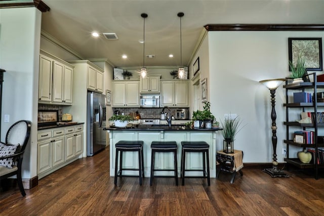 3434 Crampton Gap Way, Norman, OK 73069 - kitchen featuring appliances with stainless steel finishes, crown molding, dark countertops, backsplash, and decorative light fixtures