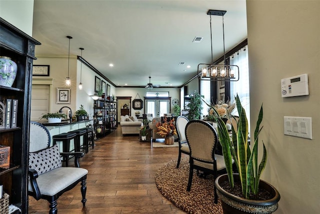 3434 Crampton Gap Way, Norman, OK 73069 - interior space featuring dark wood-style floors, ornamental molding, and recessed lighting