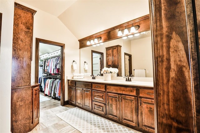 3434 Crampton Gap Way, Norman, OK 73069 - full bath featuring lofted ceiling, double vanity, and a walk in closet