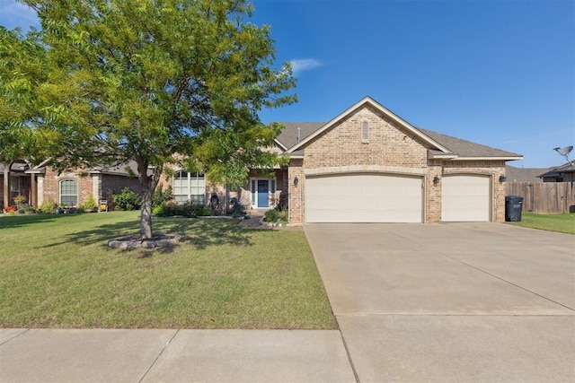 2913 Elmo Way, Oklahoma City, OK 73160 - view of front of property with brick siding, an attached garage, and driveway