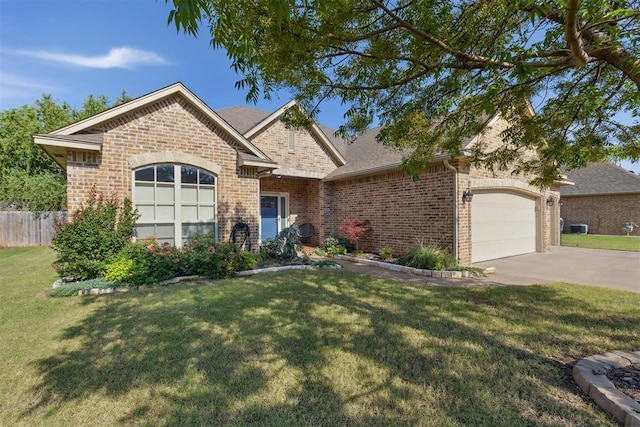 2913 Elmo Way, Oklahoma City, OK 73160 - traditional-style home with brick siding, driveway, a garage, and central air condition unit