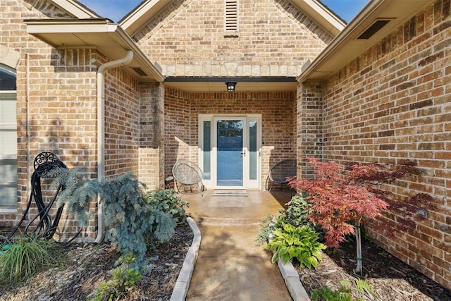 2913 Elmo Way, Oklahoma City, OK 73160 - doorway to property featuring brick siding