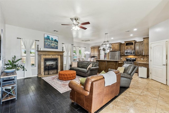 2913 Elmo Way, Oklahoma City, OK 73160 - living room featuring ceiling fan, a fireplace, and recessed lighting