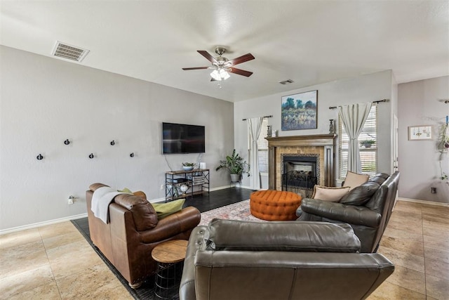 2913 Elmo Way, Oklahoma City, OK 73160 - living room with ceiling fan, baseboards, and a fireplace