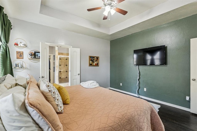 2913 Elmo Way, Oklahoma City, OK 73160 - bedroom with wood finished floors, baseboards, a raised ceiling, and ceiling fan