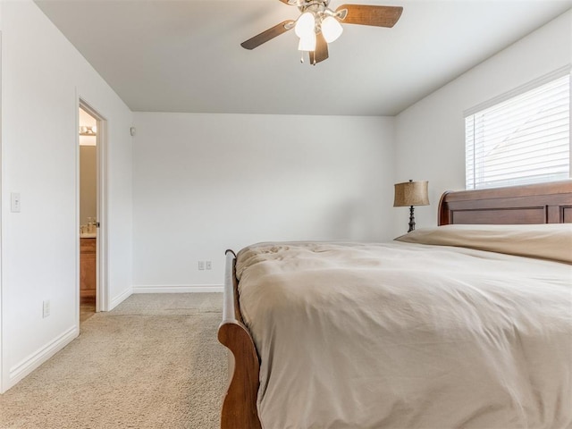 724 Ga Zump Dr, Norman, OK 73069 - carpeted bedroom featuring baseboards, ceiling fan, and ensuite bath