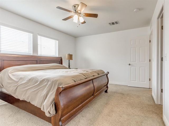 724 Ga Zump Dr, Norman, OK 73069 - carpeted bedroom with baseboards and ceiling fan