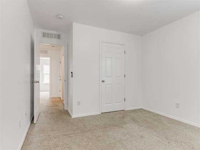 724 Ga Zump Dr, Norman, OK 73069 - unfurnished bedroom featuring light colored carpet and baseboards