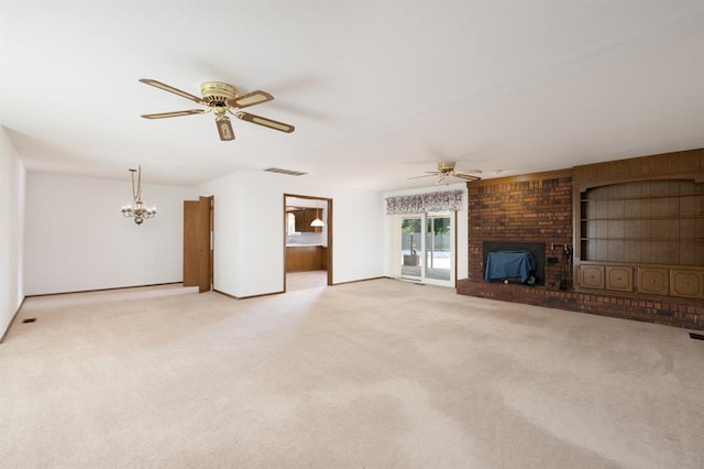 3860 Wake Forest Rd, Edmond, OK 73034 - unfurnished living room featuring a ceiling fan, a fireplace, light carpet, and a chandelier