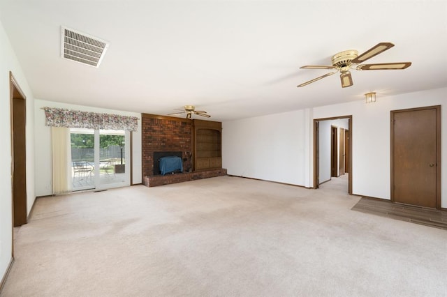 3860 Wake Forest Rd, Edmond, OK 73034 - unfurnished living room featuring ceiling fan, light carpet, and a fireplace