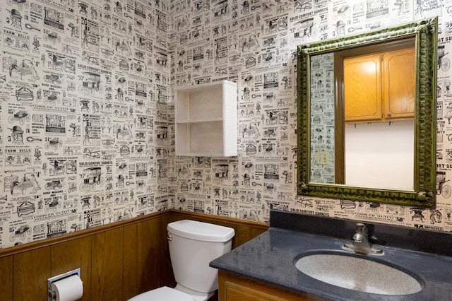 3860 Wake Forest Rd, Edmond, OK 73034 - bathroom featuring wallpapered walls, vanity, and wainscoting