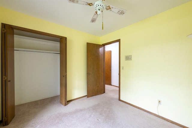 3860 Wake Forest Rd, Edmond, OK 73034 - unfurnished bedroom with light carpet, a closet, and a ceiling fan