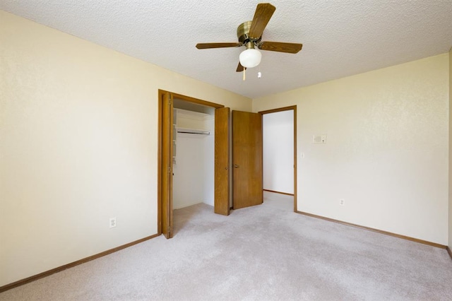 3860 Wake Forest Rd, Edmond, OK 73034 - unfurnished bedroom featuring light carpet, a closet, a textured ceiling, and a ceiling fan