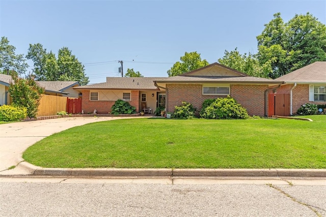 4912 NW 29th St, Oklahoma City, OK 73127 - single story home with brick siding and concrete driveway
