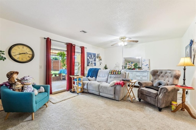 4912 NW 29th St, Oklahoma City, OK 73127 - carpeted living room with ceiling fan and a textured ceiling