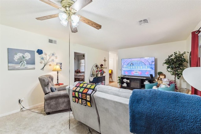 4912 NW 29th St, Oklahoma City, OK 73127 - living area featuring light colored carpet and a ceiling fan
