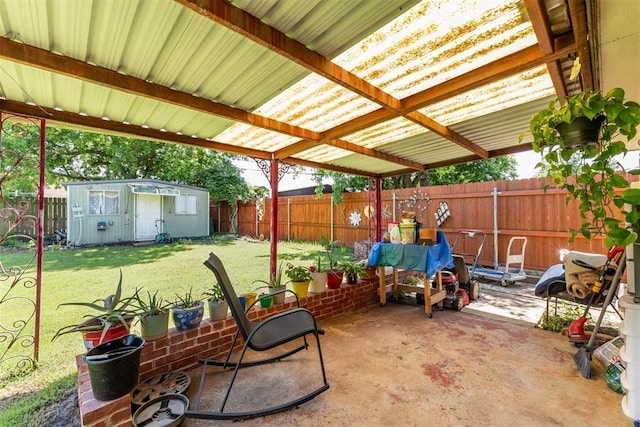 4912 NW 29th St, Oklahoma City, OK 73127 - fenced backyard with a patio area and a storage shed