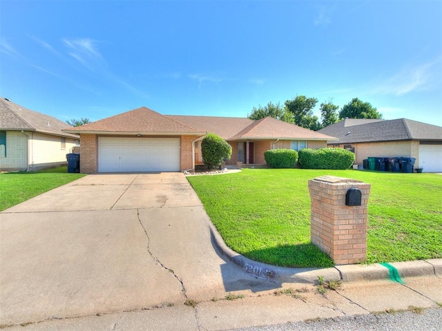 5201 SE 53rd St, Oklahoma City, OK 73135 - ranch-style home featuring an attached garage, a front yard, brick siding, and driveway
