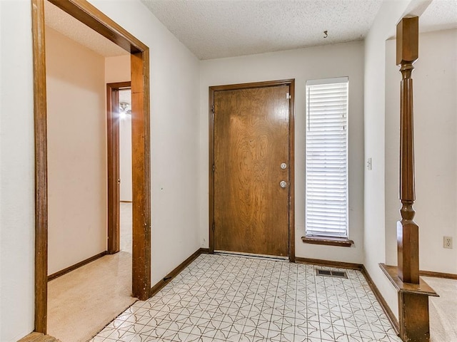 5201 SE 53rd St, Oklahoma City, OK 73135 - entrance foyer with baseboards and a textured ceiling