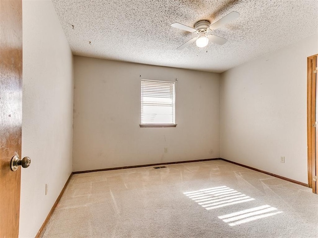 5201 SE 53rd St, Oklahoma City, OK 73135 - carpeted spare room with ceiling fan, a textured ceiling, and baseboards
