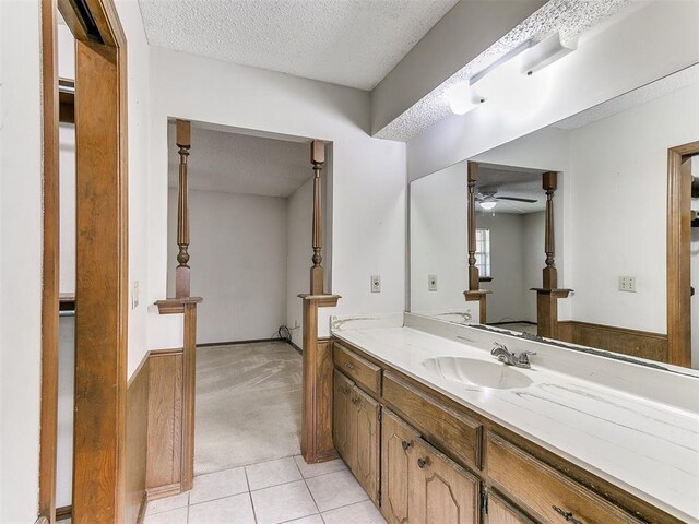 5201 SE 53rd St, Oklahoma City, OK 73135 - bathroom with a textured ceiling, a ceiling fan, vanity, and tile patterned floors