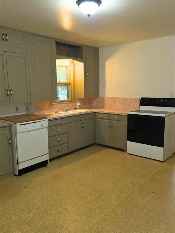 926 S 9th St, Chickasha, OK 73018 - kitchen featuring range with electric cooktop, white dishwasher, gray cabinets, and light countertops