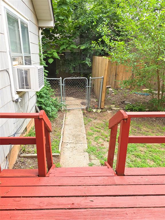 926 S 9th St, Chickasha, OK 73018 - wooden deck with a gate and cooling unit