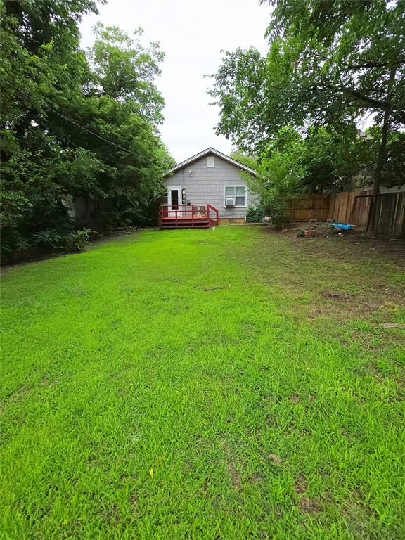 926 S 9th St, Chickasha, OK 73018 - view of yard with a deck