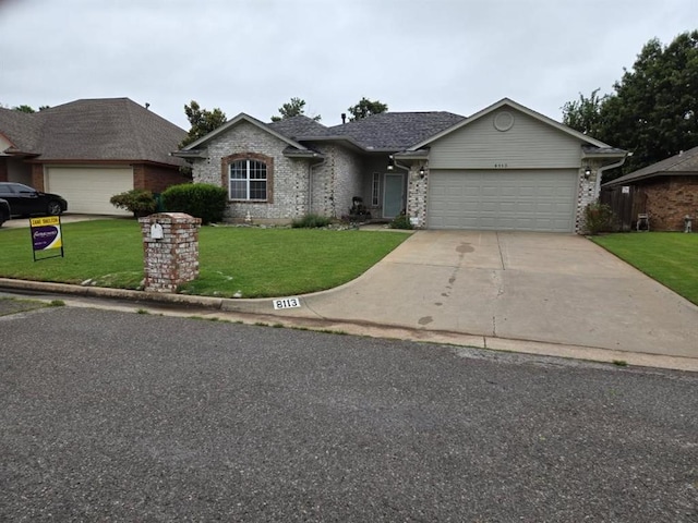 8113 Turtle Dove Dr, Oklahoma City, OK 73132 - view of front facade featuring a garage, a front lawn, driveway, and brick siding