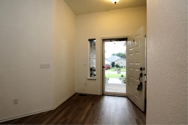 8113 Turtle Dove Dr, Oklahoma City, OK 73132 - foyer with dark wood-type flooring and a textured wall