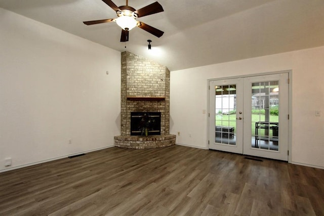 8113 Turtle Dove Dr, Oklahoma City, OK 73132 - unfurnished living room with french doors, vaulted ceiling, wood finished floors, a ceiling fan, and a fireplace