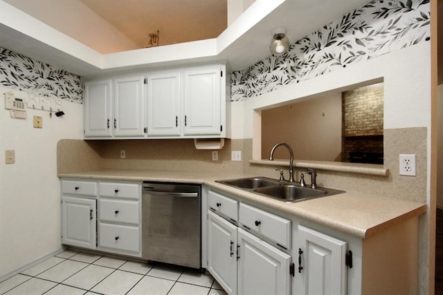 8113 Turtle Dove Dr, Oklahoma City, OK 73132 - kitchen with dishwasher, white cabinets, light countertops, light tile patterned floors, and a tray ceiling