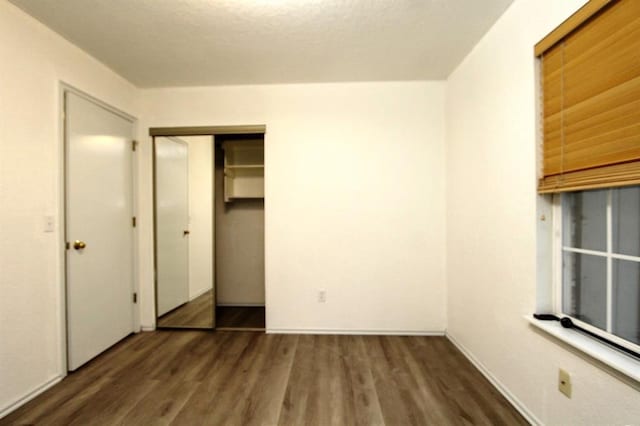 8113 Turtle Dove Dr, Oklahoma City, OK 73132 - unfurnished bedroom featuring wood finished floors and baseboards