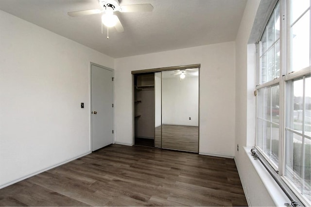 8113 Turtle Dove Dr, Oklahoma City, OK 73132 - unfurnished bedroom with wood finished floors, a closet, and a ceiling fan