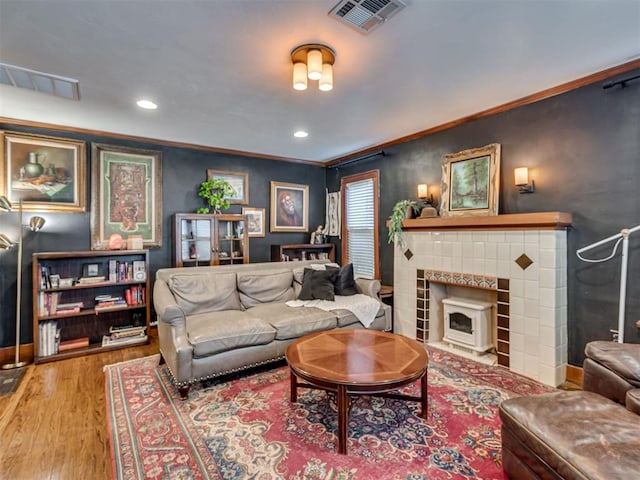 1616 NW 41st St, Oklahoma City, OK 73118 - living room featuring wood finished floors, crown molding, recessed lighting, and a fireplace with flush hearth