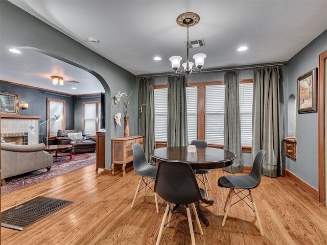 1616 NW 41st St, Oklahoma City, OK 73118 - dining space with arched walkways, light wood-style floors, baseboards, a chandelier, and recessed lighting