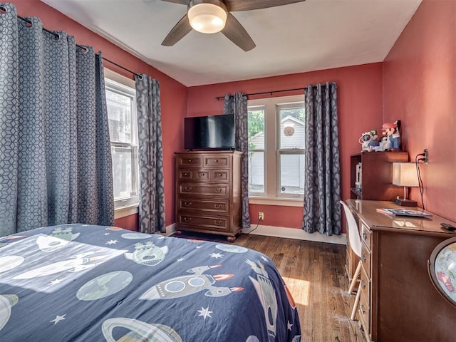 1616 NW 41st St, Oklahoma City, OK 73118 - bedroom with multiple windows, wood finished floors, baseboards, and ceiling fan