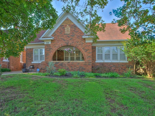 1616 NW 41st St, Oklahoma City, OK 73118 - view of front of house featuring brick siding and a front lawn