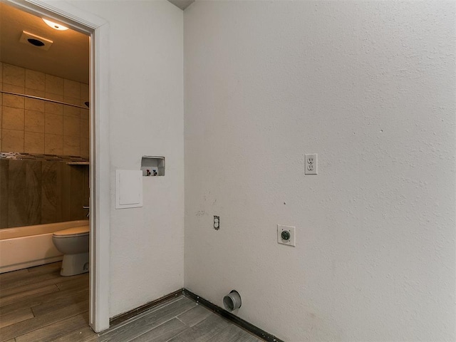 1117 Washington St, Edmond, OK 73034 - laundry room featuring washer hookup, wood finished floors, and electric dryer hookup