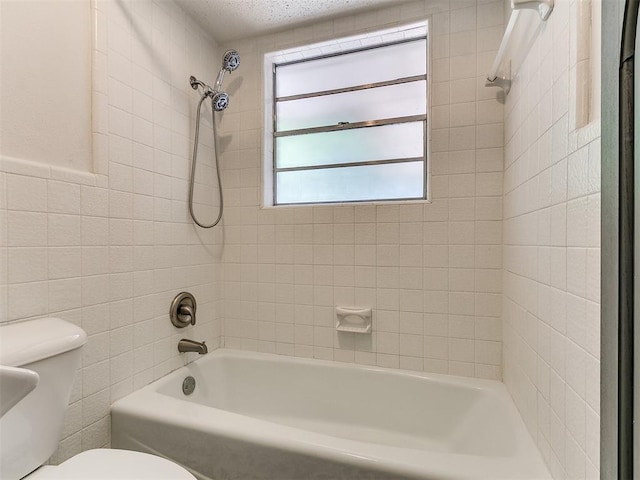 1117 Washington St, Edmond, OK 73034 - bathroom featuring tile walls and  shower combination