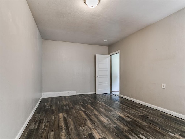 1117 Washington St, Edmond, OK 73034 - unfurnished room featuring wood finished floors and baseboards
