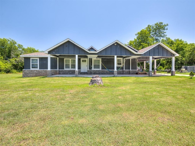 3 Antler Blvd, Mcloud, OK 74851 - back of house with a lawn and board and batten siding
