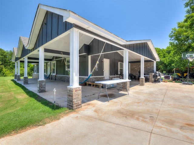 3 Antler Blvd, Mcloud, OK 74851 - back of property featuring board and batten siding and a patio