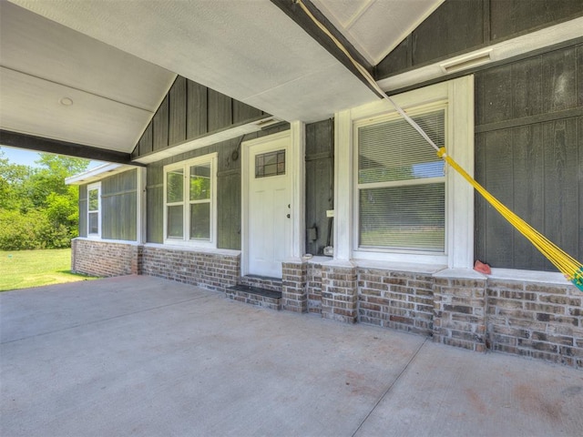 3 Antler Blvd, Mcloud, OK 74851 - property entrance featuring board and batten siding and a patio area
